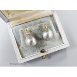 A pair of white metal, cultured Tahitian pearl and diamond cluster set earrings, pearl diameter