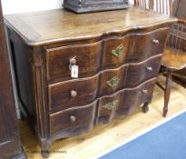 An 18th century Louis XV provincial oak and chestnut ‘Cupid’s bow fronted’ commode, width 104cm,