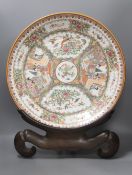 A large 20th century Chinese famille rose porcelain charger, diameter 46cm, on hardwood stand