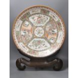 A large 20th century Chinese famille rose porcelain charger, diameter 46cm, on hardwood stand