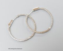 A modern pair of 18ct white gold and diamond chip set hoop earrings, diameter 32mm, gross weight 5.