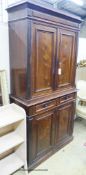 A late 19th century French rosewood two part cupboard with two drawers and panelled doors, width