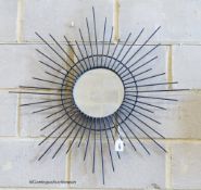 A metalwork star burst wall mirror, height 84cm