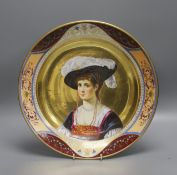 A 19th century Dresden porcelain charger, painted with a portrait of a lady, Augustus Rex mark