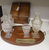 A Victorian walnut stationary cabinet, an Edwardian inlaid oval tray and a group 7 brass