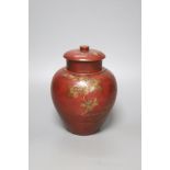 A Chinese red lacquer tobacco jar and cover, height 18cm