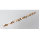 A modern 9ct gold and five stone oval cabochon moss agate and gate link set bracelet, 18.3cm, gross