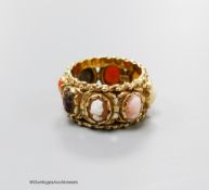 A 14kt yellow metal and multi cameo stone set eternity ring, including shell and coral, size P,