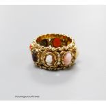 A 14kt yellow metal and multi cameo stone set eternity ring, including shell and coral, size P,