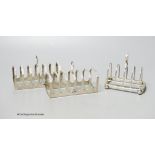 A pair of silver toast racks, Sheffield, 1950, 11.3cm and one other silver toastrack, 7oz.