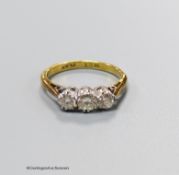 An 18ct & plat and three stone diamond set ring, size J, gross weight 2.3 grams.