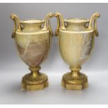 A pair of gilt metal and marble urns, overall height 34cm