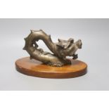 An Indonesian bronze dragon, on stand, height 17cm