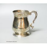 A George II silver baluster mug, with acanthus leaf capped handled and engraved crest, Henry Brind,