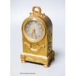 A small French gilt brass cased mantel timepiece, c.1900, of arched form, 15.5cm high.