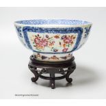 A 18th century Chinese export porcelain footed punch bowl on hardwood stand, diameter 20cm,