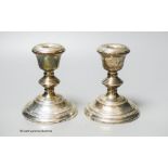 A modern pair of silver mounted dwarf candlesticks, Birmingham, 1967, 12.2cm, weighted.