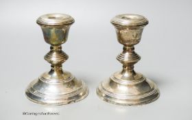 A modern pair of silver mounted dwarf candlesticks, Birmingham, 1967, 12.2cm, weighted.