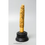 A 19th century Indonesian ivory Dha handle, on plinth, height 18cm