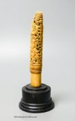 A 19th century Indonesian ivory Dha handle, on plinth, height 18cm