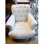A Laura Ashley armchair upholstered in buttoned natural fabric, width 82cm, depth 90cm, height 86cm