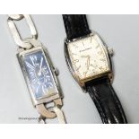 An 800 standard white metal rectangular manual wind wrist watch on a large curb link bracelet,