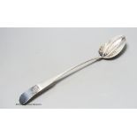An early George III Irish silver fiddle pattern basting spoon, with strainer, Dublin, 1763, 33.9cm,