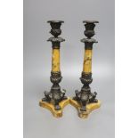 A pair of Empire bronze and Sienna marble candlesticks, height 32cm