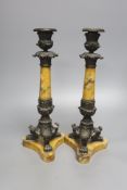 A pair of Empire bronze and Sienna marble candlesticks, height 32cm