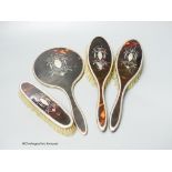 A 1920's silver and tortoiseshell pique four piece mirror and brush set.