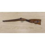 An early 19th century Belgian percussion cap carbine with carved walnut stock and silver inlaid