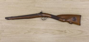 An early 19th century Belgian percussion cap carbine with carved walnut stock and silver inlaid