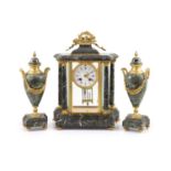 A 19th century French ormolu mounted black variegated three piece clock garniturethe white