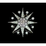 A Victorian gold, silver and diamond set starburst pendant brooch,with detachable brooch