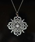 A good Victorian gold, silver and diamond set open work pendant,of quatrefoil shape, the central