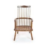 An 18th century West Country elm and fruitwood primitive armchairwith comb back and saddle seatH