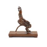 A Chinese scholar's rootwood carving of a deer, 18th century,with rich chestnut brown patina,25cm