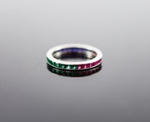 A platinum? ruby, emerald and sapphire set full eternity ring,size M, gross weight 1.6 grams.