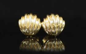 A modern pair of Tiffany & Co 18ct gold cufflinks,of fluted shell form, 27.4 grams.