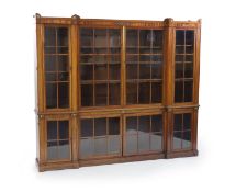 A Regency style mahogany inverse breakfront bookcasewith gilt brass mounts and for glazed board