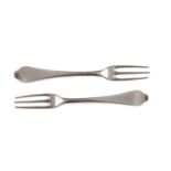 A pair of George I silver three-prong forks, with dog nose terminals, engraved with armorials,