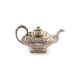 A William IV Irish silver squat melon shaped teapot by Robert W. Smith,with engraved monogram and