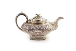 A William IV Irish silver squat melon shaped teapot by Robert W. Smith,with engraved monogram and