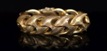 A 1970's brushed 18ct gold bracelet, 18.5cm, 57.3 grams.