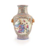 A Chinese famille rose millefleur vase, Qianlong mark but Republic period,painted with court