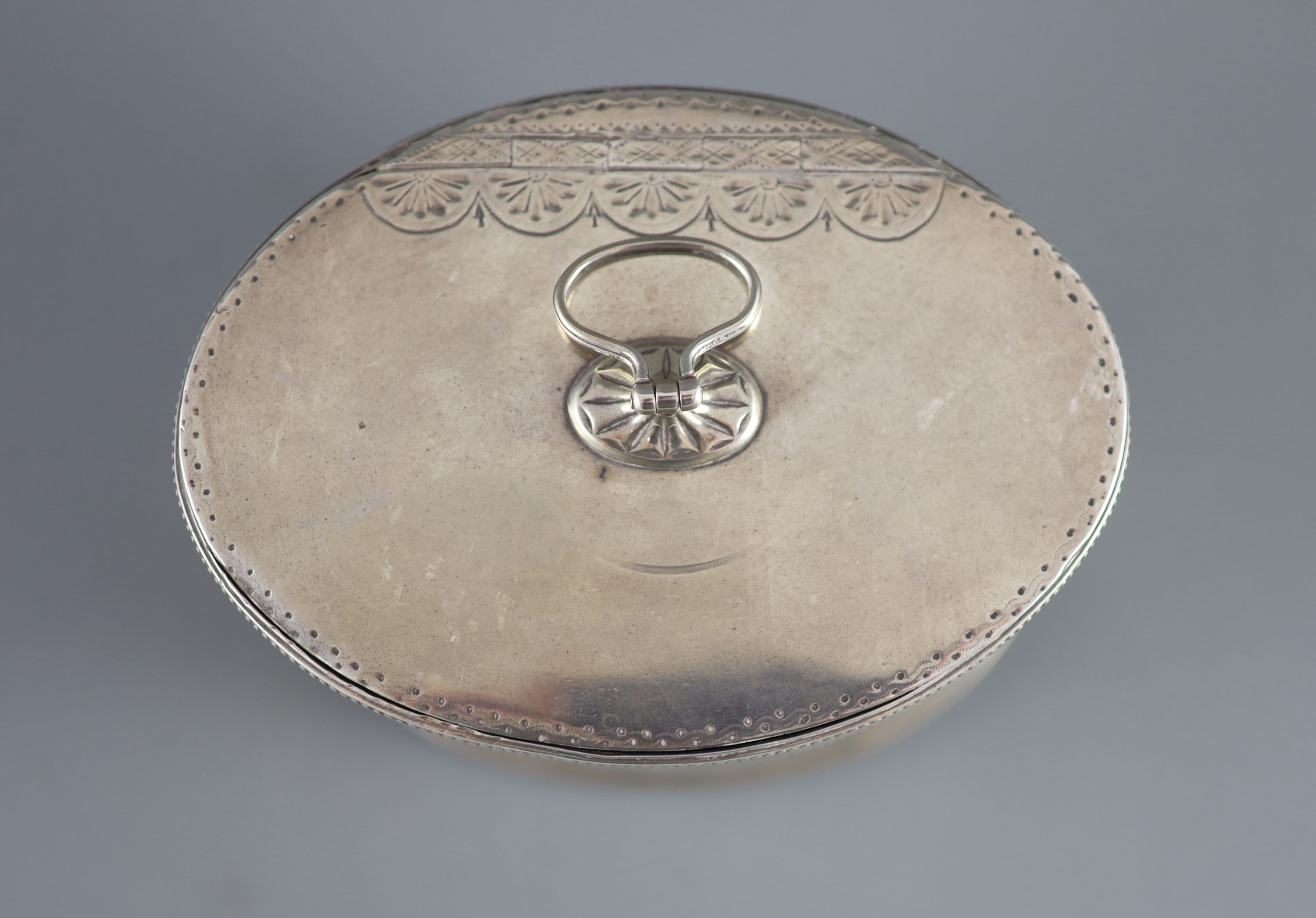 A George III silver oval tea caddy by John Younge & Co,with engraved crest, ring handle and beaded - Image 3 of 5