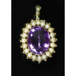 An early 20th century gold, amethyst and split pearl set oval pendant brooch,overall 42mm, gross