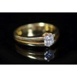 A late Victorian 22ct yellow gold diamond solitaire ring, the claw-set oval cut diamond