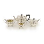 A late Victorian four-piece silver tea set comprising teapot, lidded bowl, twin handed sugar basin