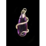 A Victorian gold mounted pear shaped amethyst pendant, entwined with diamond and ruby set serpent,